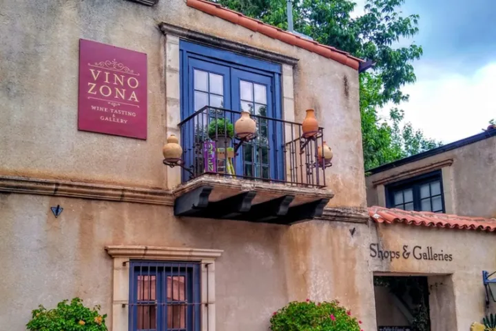 a sign in front of a brick building