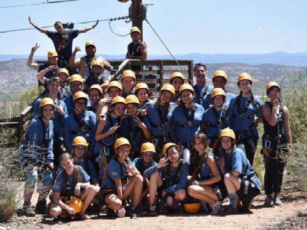 a group of people posing for the camera